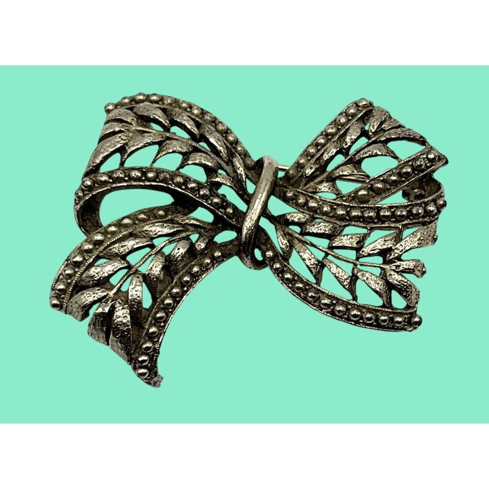 Vintage Hobe 1960s Silver-Tone Bow Brooch With Intricate Filigree Design